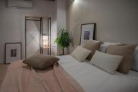 Postel nebo postele na pokoji v ubytování Suites Jardines de la Alhambra