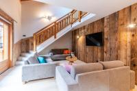 Televízia a/alebo spoločenská miestnosť v ubytovaní CHALET EAGLE