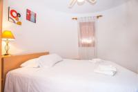 A bed or beds in a room at Villa Erik - PlusHolidays