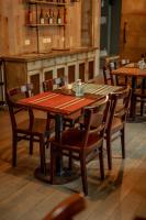 a wooden table and chairs in a restaurant at Smart Hotel Montevideo in Montevideo