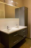 a bathroom with a sink and a mirror at Luxe penthouse center Kortrijk in Kortrijk