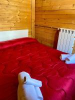 Uma cama ou camas num quarto em B&amp;B Snow Village Roccaraso