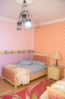 Postel nebo postele na pokoji v ubytování Kenzy guest house