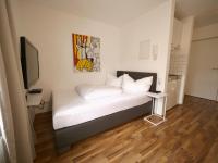 A bed or beds in a room at Astoria Apartments