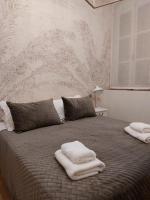Posteľ alebo postele v izbe v ubytovaní Hidden Gem Pasquin Suites in Mercado Central