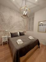 Posteľ alebo postele v izbe v ubytovaní Hidden Gem Pasquin Suites in Mercado Central