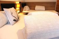 A bed or beds in a room at Apart Garni Jägerheim