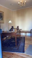 a living room with a table and a couch at Chez Hélène 3 étoiles, labellisé disabled PMR,pour 4 personnes chiens bienvenus-pet friendly in Bourg-Madame