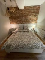 Posteľ alebo postele v izbe v ubytovaní APARTAMENTY GUZIK