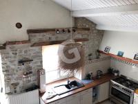 a kitchen with a sink and a stone wall at Maison Le Bernard, 5 pièces, 6 personnes - FR-1-357-253 in Le Bernard