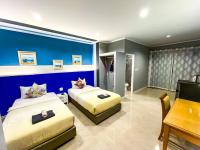 Postel nebo postele na pokoji v ubytování Aen Guy Boutique Hotel