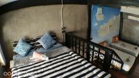 Postel nebo postele na pokoji v ubytování Aen Guy Boutique Hotel