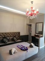 Postel nebo postele na pokoji v ubytování Aen Guy Boutique Hotel