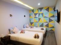 Postel nebo postele na pokoji v ubytování Aen Guy Boutique Hotel