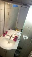 a bathroom with a white sink and a mirror at Mandévilla et Tropical Dream in Les Trois-Îlets