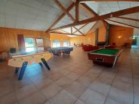 a large room with two pool tables and couches at Appartement Samoëns, 3 pièces, 6 personnes - FR-1-624-103 in Samoëns