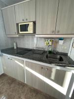 Kuchyň nebo kuchyňský kout v ubytování Casa Piscina
