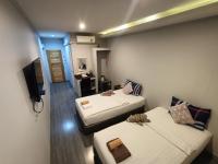 Postel nebo postele na pokoji v ubytování Aen Guy Boutique Hotel