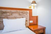 Postel nebo postele na pokoji v ubytování Pansion Lipa