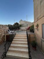 a set of stairs leading up to a building at Ta’ Peppi Farmhouse in Qala