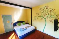 Postel nebo postele na pokoji v ubytování Aen Guy Boutique Hotel