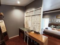 Postel nebo postele na pokoji v ubytování Aen Guy Boutique Hotel
