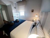 A bed or beds in a room at Sun And Chic Malaga