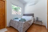 A bed or beds in a room at Villa Meretseger