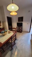 Televízia a/alebo spoločenská miestnosť v ubytovaní Apartamento San Benito A