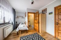 Posteľ alebo postele v izbe v ubytovaní Apartamenty u Bacy