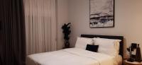 Posteľ alebo postele v izbe v ubytovaní Homing Volos Inspired Modern Living