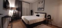 Posteľ alebo postele v izbe v ubytovaní Homing Volos Inspired Modern Living