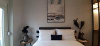 Posteľ alebo postele v izbe v ubytovaní Homing Volos Inspired Modern Living