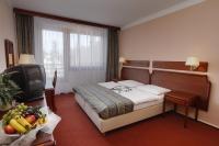 Postel nebo postele na pokoji v ubytování Hotel Krakonoš