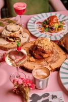 a table topped with plates of food and drinks at Imperial Hotel Cork City in Cork