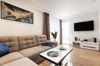 Telewizja i/lub zestaw kina domowego w obiekcie Apartamenty Granitica Zakopane