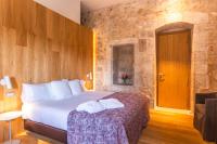 Postel nebo postele na pokoji v ubytování Hotel Mas Bosch 1526