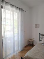A bed or beds in a room at Villa Stella Family House