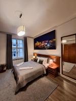 Łóżko lub łóżka w pokoju w obiekcie Witrina Apartments
