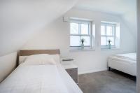 Postel nebo postele na pokoji v ubytování Ferienhaus Maira, mit Garten und Sauna