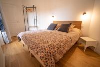 Łóżko lub łóżka w pokoju w obiekcie Appartement cosy en cœur de bourg