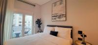 Posteľ alebo postele v izbe v ubytovaní Homing Volos Inspired Modern Living