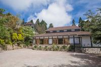 a building with a parking lot in front of it at Naluwan Villa in Ren&#39;ai