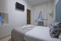 Posteľ alebo postele v izbe v ubytovaní Carreteria 73 Malaga Center