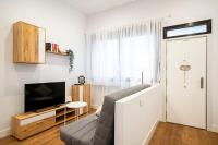 TV a/nebo společenská místnost v ubytování Apartamento tranquilo y familiar a 30 Min de SOL