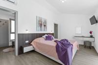 Posteľ alebo postele v izbe v ubytovaní Villa Casa Mara