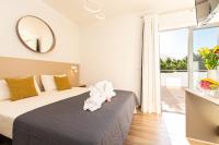 Postel nebo postele na pokoji v ubytování Suncanarias Hotel Adeje Plaza