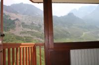 a view of a mountain view from a window at Le Cocon Themnest in La Mongie