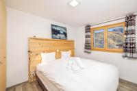 Chalet Amerhone - Luxury chalet With Jacuzziにあるベッド