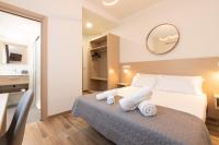Postel nebo postele na pokoji v ubytování Suncanarias Hotel Adeje Plaza